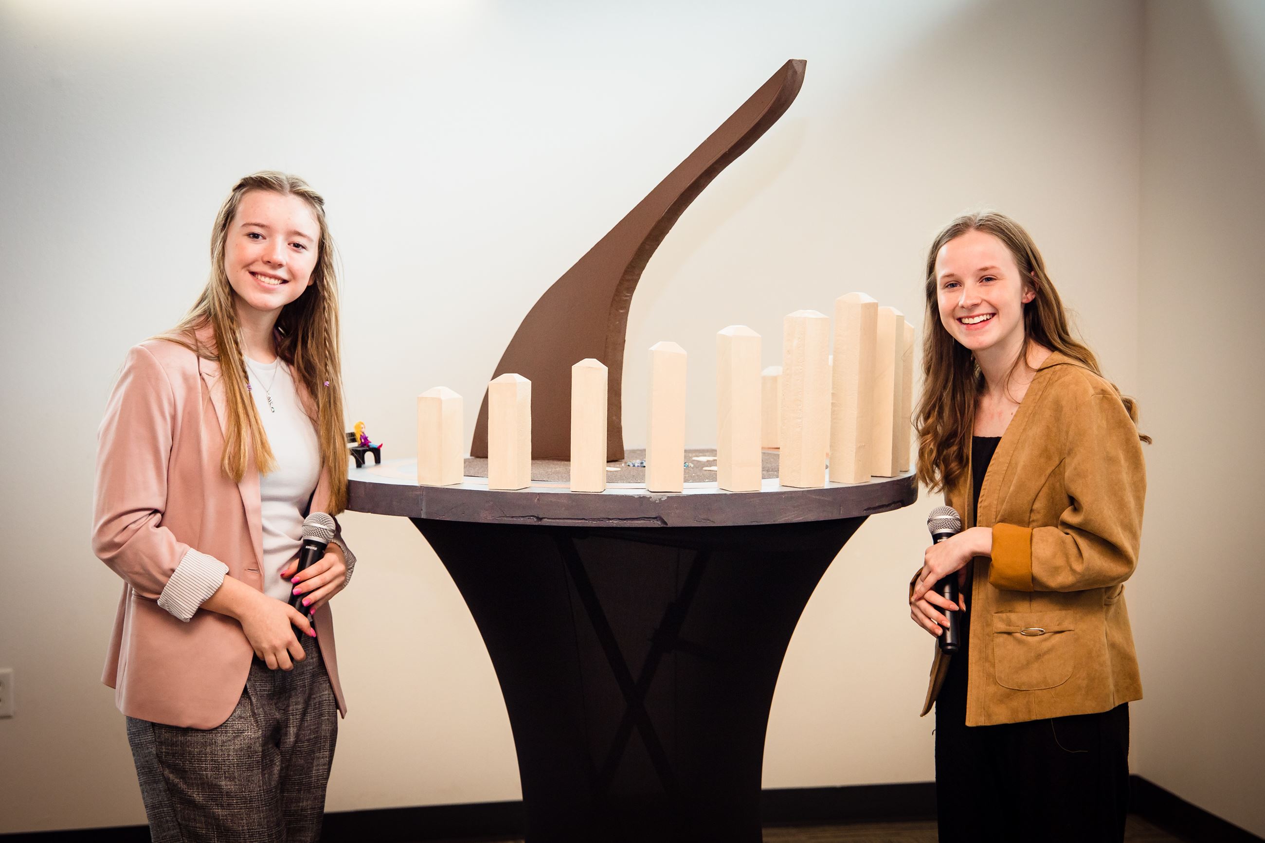 Image of Two Girls Smiling in Front of a Sun Dial Diorama #2