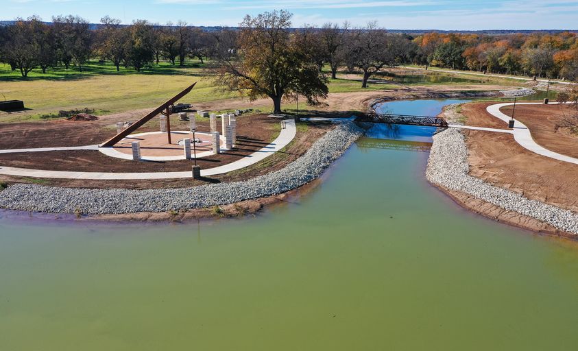 Image of the Town Center river, the sundial is on the left.