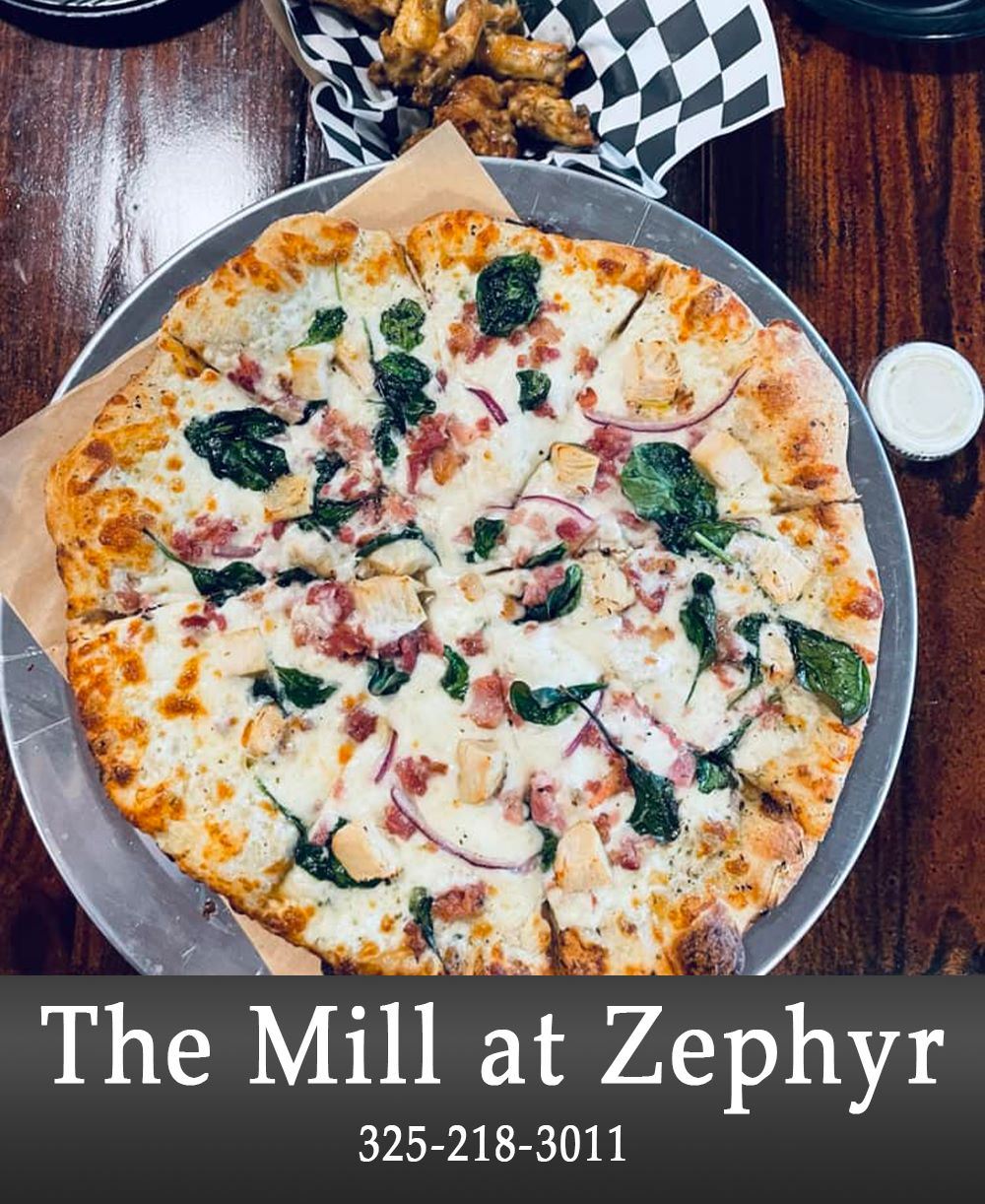 Image of a Pizza on a Plate with Business Information Listed Below