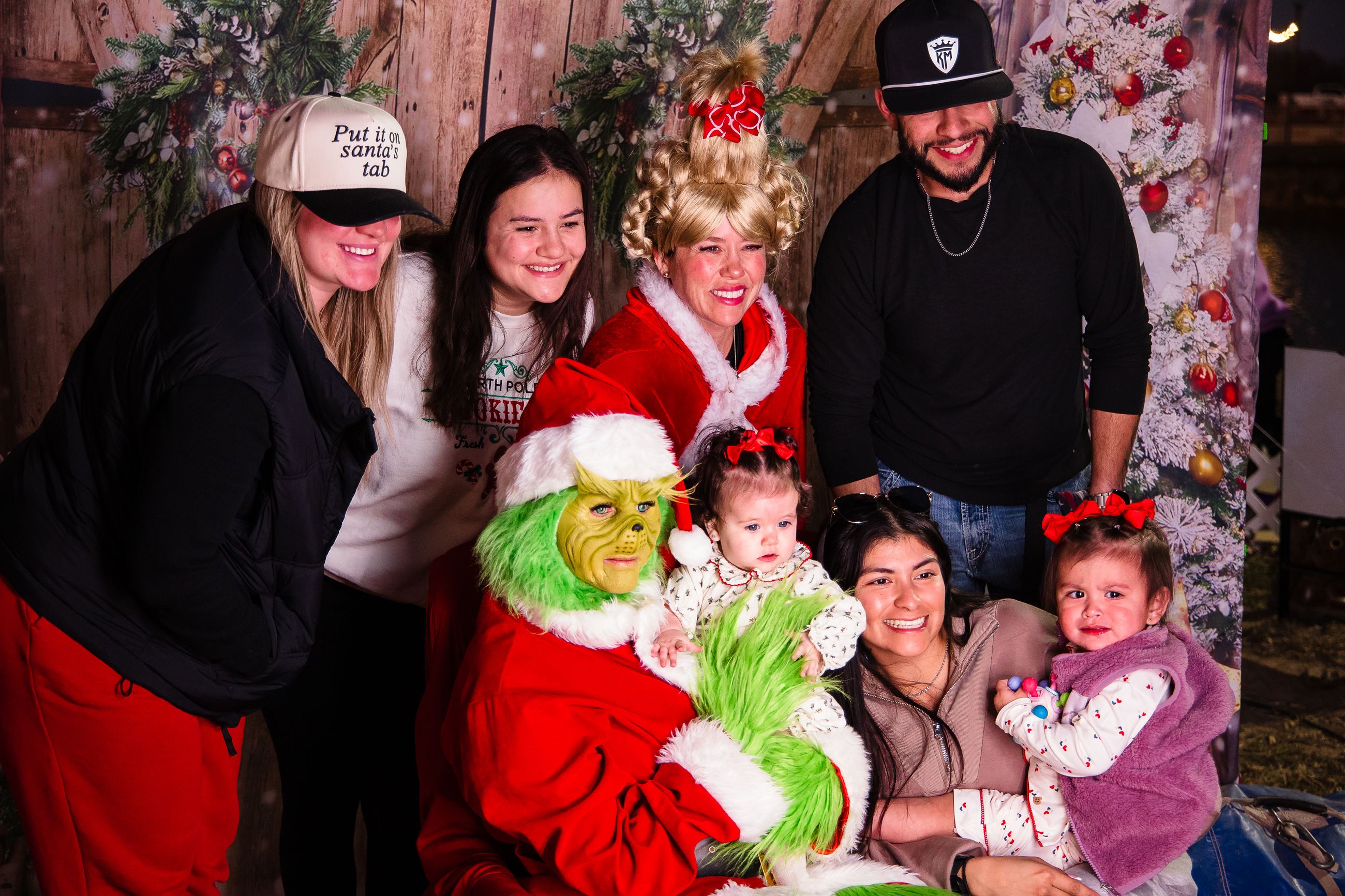 Picture of 8 people with the Grinch and Sandy Lou