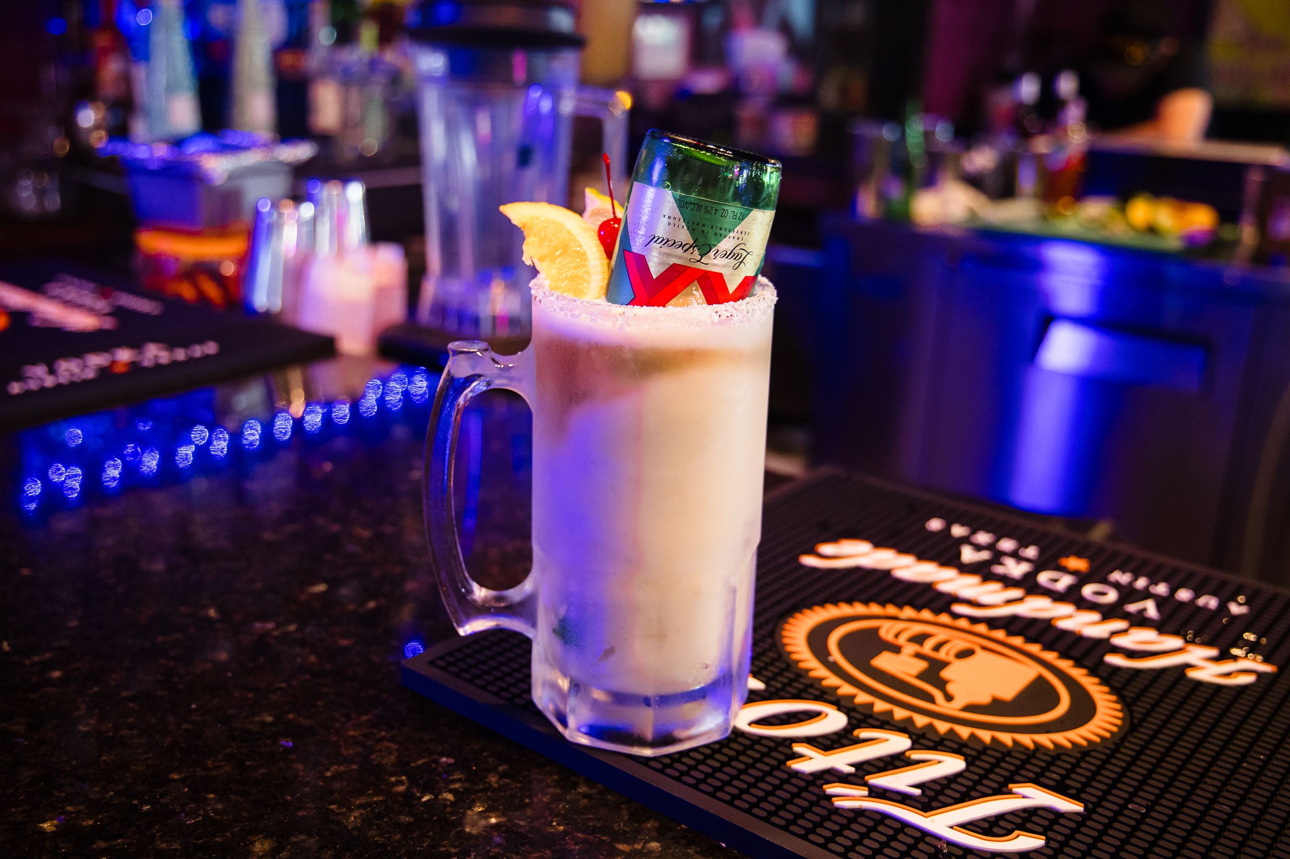 Picture of a glass drink with a beer on top